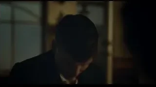 person with head resting on table in bar — Peaky Blinders