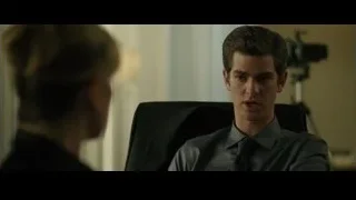 Man and woman conversing in office — The Social Network