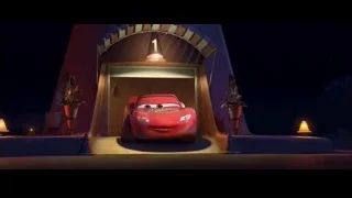 Lightning McQueen parked under archway at night — Cars