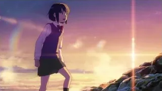 Girl on rocky cliff overlooking sunset — Your Name
