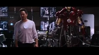 man in room with Iron Man robot — Iron Man