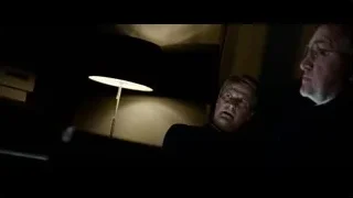Two men looking at laptop in dim room — Steve Jobs