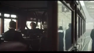 man in suit looking out train window — Peaky Blinders