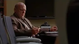 Bald man sitting at office desk — Breaking Bad