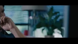 Man with earphones at computer monitor — The Big Short