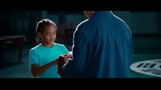 man comforting crying girl in dimly lit room — The Karate Kid