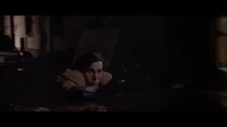 man holding gun in dark room — American Psycho