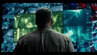 man looking at large screen with images — Jurassic World