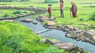 three people on rocky stream shore — Your Name