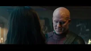 Man in suit and woman conversing — Deadpool 2