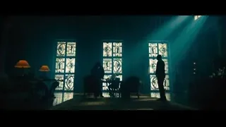 two people in dimly lit room with stained glass — John Wick: Chapter 4