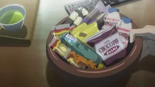 Desk with green tea, snacks and calculator — Weathering with You