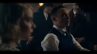 man with cigarette at table — Peaky Blinders