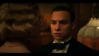 man in tuxedo looking at woman with necklace — Peaky Blinders