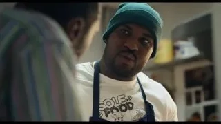 Man in green beanie in kitchen — The Bear