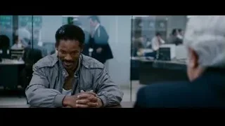man sitting at office desk in conversation — The Persuit of Happyness