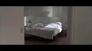 Modern bedroom with large bed and window — American Psycho