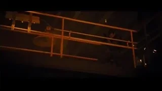 Man holding rifle in dark room — Furious Seven