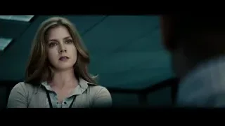 woman with serious expression in dark room — Superman: Man of Steel