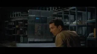 man looking at cabinet in dim warehouse — Interstellar