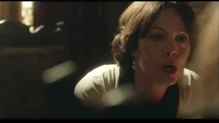 Woman's face in deep thought in dimly lit room — Peaky Blinders