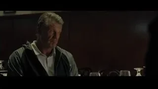 man sitting at table in dimly lit restaurant — Creed 2