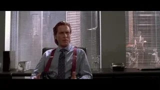 man in suit at office desk — American Psycho
