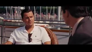 Two men conversing on a balcony — The Wolf Of Wall Street