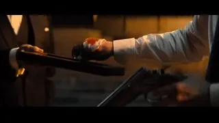 Person's hands holding a gun — John Wick: Chapter 4
