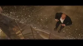 man in suit walking through flooded hallway — Furious Seven