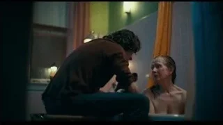 man washing woman's hair in bathtub — Joker