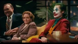 Joker sitting on couch in living room — Joker