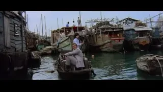 man and woman on boat in harbor — Bruce Lee: Enter The Dragon