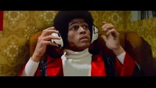 young man with afro wearing headphones — Bruce Lee: Enter The Dragon