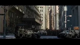 armored vehicles on snowy city street — Batman: The Dark Knight Rises
