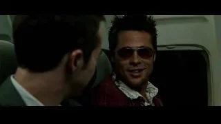 man in plaid shirt and sunglasses on airplane — Fight Club