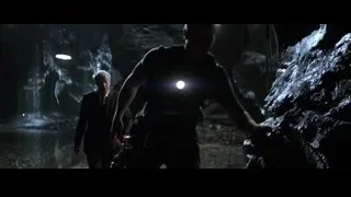 Two men walking in dark cave — Batman