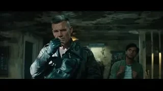 man in leather jacket with gun — Deadpool 2