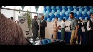 people gathered around table with balloons — Ford v Ferrari