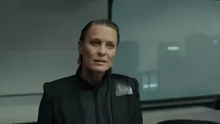 woman in uniform before city skyline screen — Blade Runner 2049