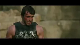 Bearded man in leather vest battle stance — Gladiator 2