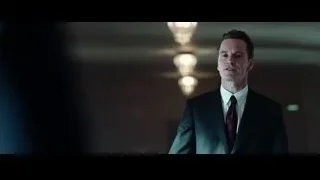man in suit in dimly lit room — Steve Jobs