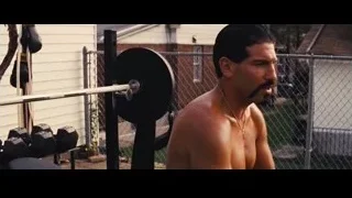 Shirtless man lifting barbell in gym — The Wolf Of Wall Street