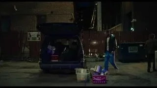 Man loading car trunk on street at night — The Bear
