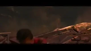 Man in red costume running through rubble — Spiderman: No Way Home