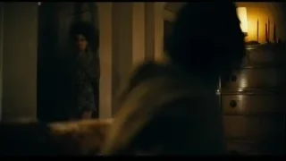 woman with afro in dilapidated room — Joker
