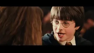boy in suit and glasses looking serious — Harry Potter and the Philosophers Stone