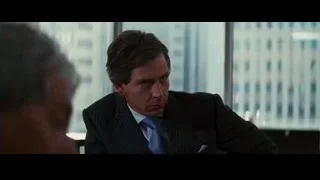 Man in suit at office desk — Batman: The Dark Knight Rises