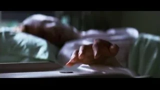 Person lying in bed with coin — Batman: The Dark Knight