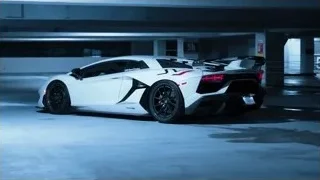 white Lamborghini parked in garage — Sports Cars